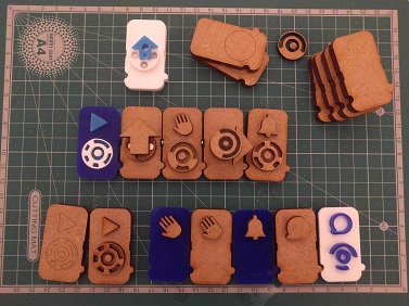 A set of wodden programming blocks with tangible 3D icons and crafted top codes for camera recognition